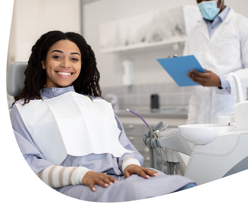 Woman smiling while at a dentist visit